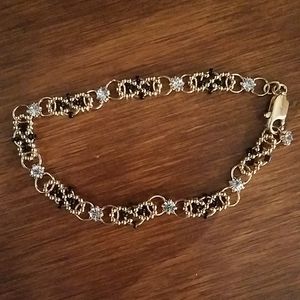 BEAUTIFUL New gold, black  & clear gem bracelet